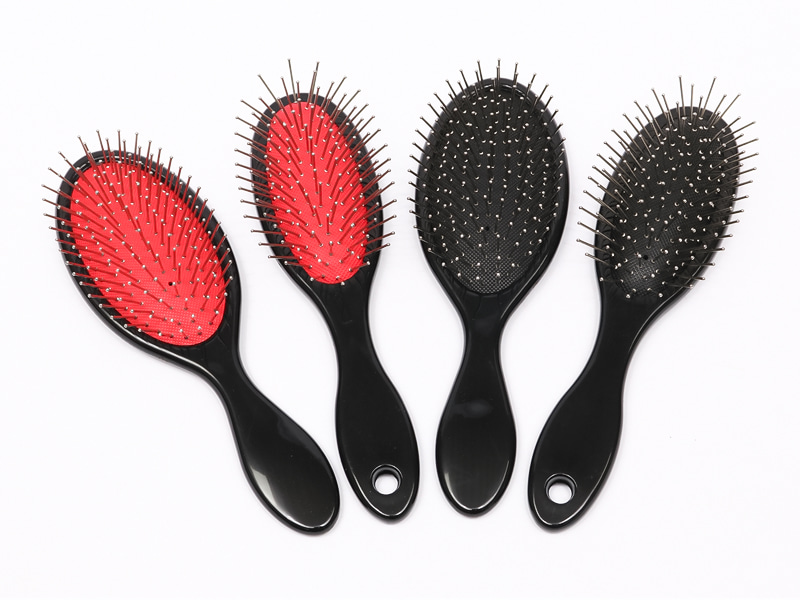 Plastic haarborstel voor massage met peddelkop