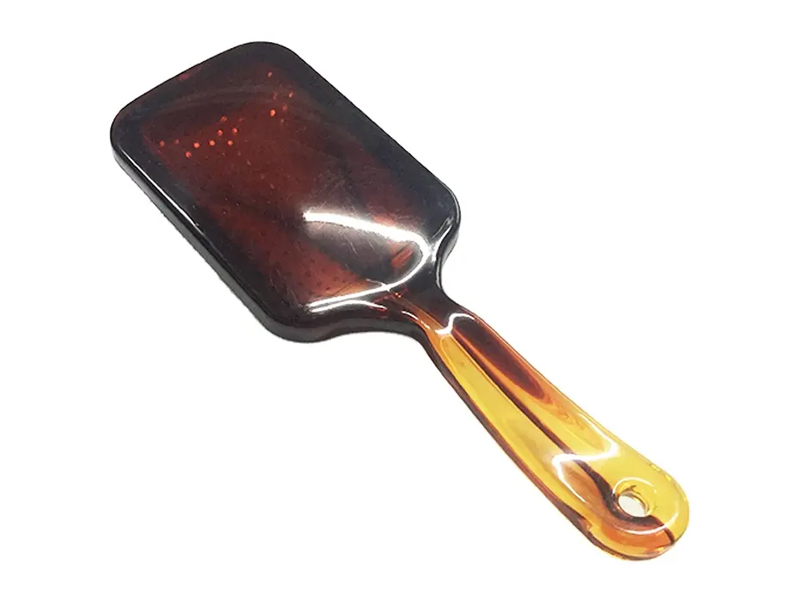 Amberkleurige paddle-haarborstel met metalen pinnen
