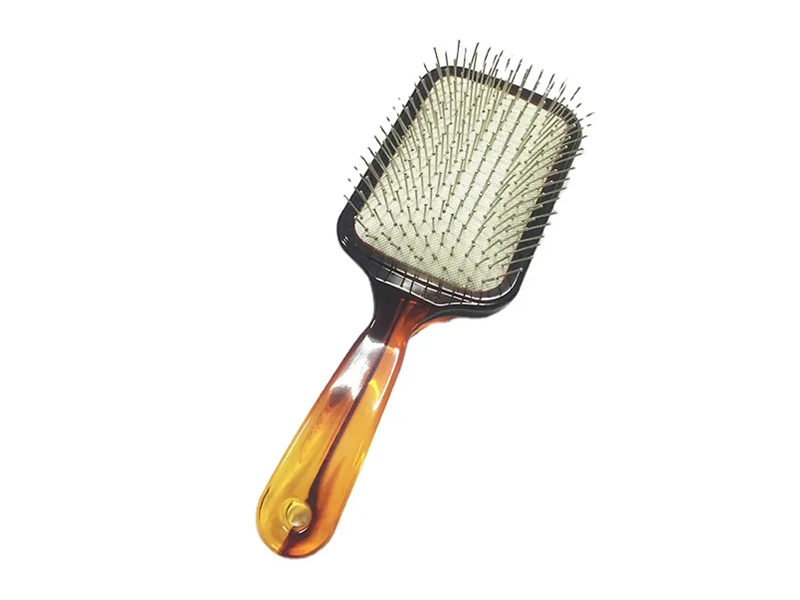 Amberkleurige paddle-haarborstel met metalen pinnen